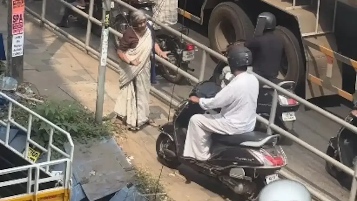 Viral Video of Elderly Woman Stopping Scooter Sparks Debate
